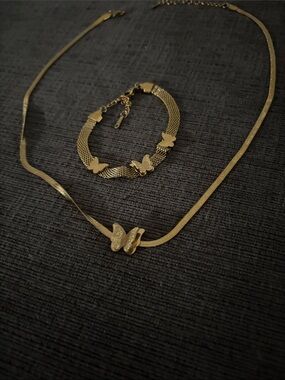Gold tone butterfly necklace with matching bracelet